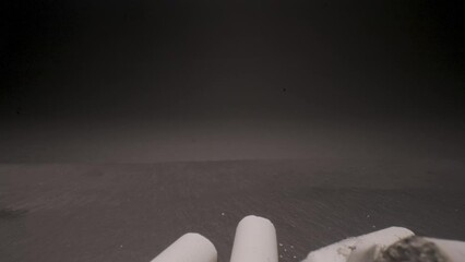 Extinguished cigarettes isolated on black table