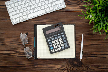 Business accounter working place with taxes and calculator