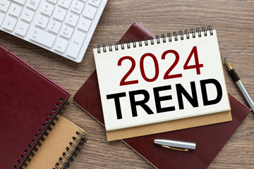 Trend 2024 torn page text on brown notepad