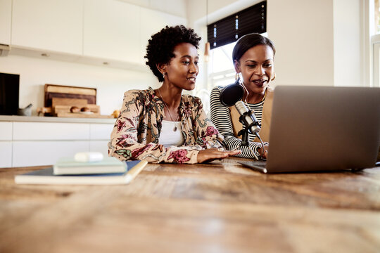 Women doing a podcast at home