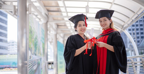 Happy student graduate hand holding diplomas and gold prize coins.