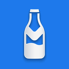 Paper cut Beer bottle icon isolated on blue background. Paper art style. Vector