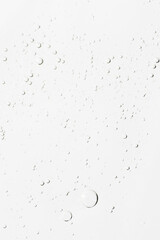 The texture of the serum or gel. Transparent cream with bubbles in the background. Transparent cosmetic gel in close-up. .Oxygen bubbles. .