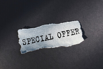 Special offer text on torn paper on craft paper background