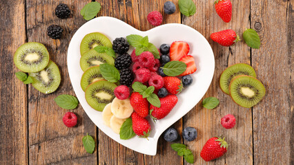 heart shape plate with fresh fruits- healthy summer fruits- healthy lifestyle