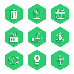 Set Plant in hand, Light bulb with leaf, Wind turbine, Apple core, Eco shop, Leaf symbol, Recycle and Trash can icon. Vector