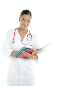 Beautiful woman doctor with colorful folders in her hands