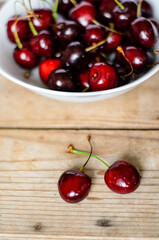 Juicy sweet cherry on old wooden background