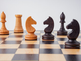 Set of wooden chessboard with chess pieces isolated on white background