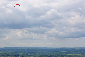 Paragliders flying at Westbury in Wiltshire