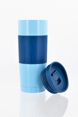 Blue vacuum flask on white background.