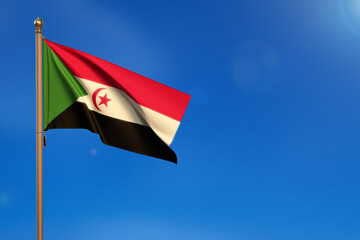 Western Sahara. Flag blown by the wind with blue sky in the background