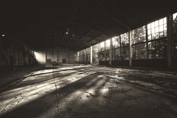 Abandoned building in sepia tones on a sunny summer day.	