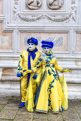 Fototapeta na wymiar Gorgeous couple in masks during the Carnival of Venice