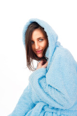 Obraz premium attractive brunette in blue bathrobe with hood isolated on white