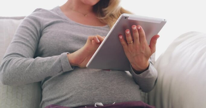 Green screen, pregnancy advertising or woman on tablet for digital baby information, tracking markers or mobile results. Pregnant, mockup or mother in home on tech for website or online research