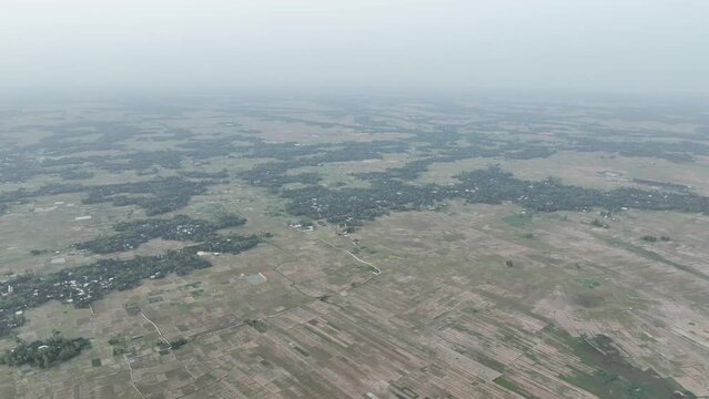 High altitude aerial view of a Bangladesh village surrounded by greenery