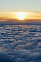 Fototapeta na wymiar sunrise above the clouds mount rainier