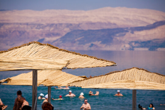 Sunshades on the Dead Sea beach from Israel