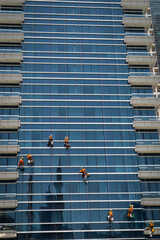Workers clean a window on a skyscraper in Dubai.