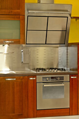 Modern stainless steel stove and kitchen ventilation