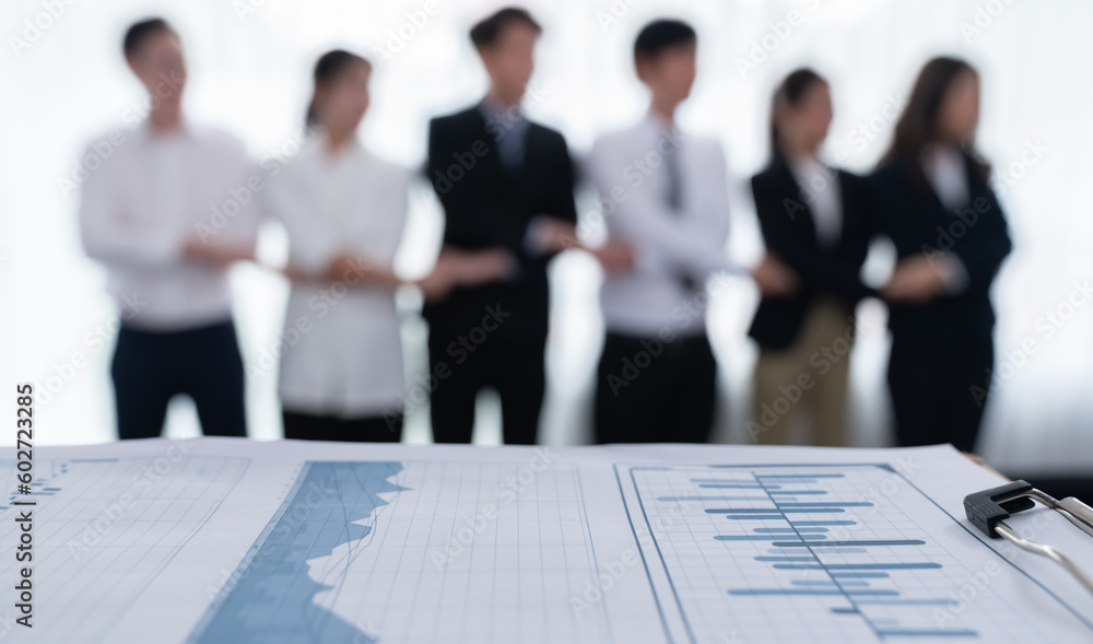 Poster closeup focus on financial report, performance result papers in front of camera with blur background