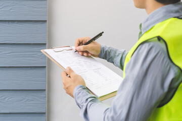 Building inspection, contractor asian young man, male inspecting home, reconstructed construction,...