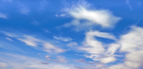 Bright blue sky with fine cirrus clouds, abstract nature background