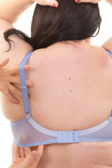 Bra fitter help plus size woman find perfect fit. Back view.