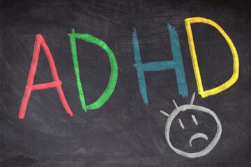 Fototapeta na wymiar Word adhd written with colored chalkboard on blackboard. Attention Deficit Hyperactivity Disorder