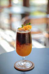 Espresso and orange juice top with fresh mango.