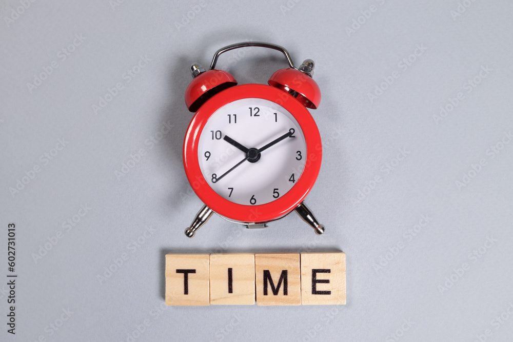 Wall mural time word and red alarm clock