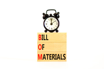 BOM bill of materials symbol. Concept words BOM bill of materials on beautiful wooden block. Alarm clock. Beautiful white table white background. Business and BOM bill of materials concept. Copy space