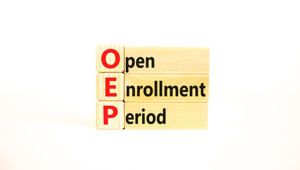 OEP symbol. Concept words OEP Open enrollment period on beautiful wooden block. Beautiful white...