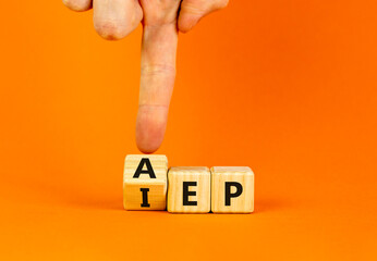 AEP or IEP symbol. Concept words AEP annual enrollment period IEP initial enrollment period. Doctor hand. Beautiful orange background. Medical annual or inintial enrollment period concept. Copy space. - obrazy, fototapety, plakaty