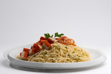 Pasta with shrimp and tomato sauce on a plate