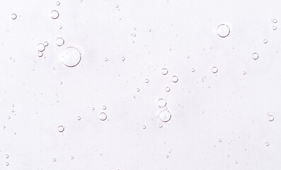 Cosmetic gel, serum transparent sample. Liquid cream with bubble texture. Gel texture of a cosmetic...