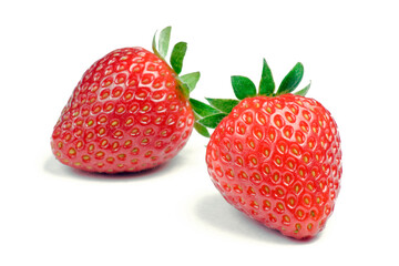 Two ripe strawberries on white background