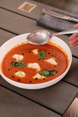 Table of italian meals on plates Pizza, pasta, ravioli, carpaccio, mushroom risotto, caprese salad and tomato bruschetta on rustic wooden background. Top view. Flat lay