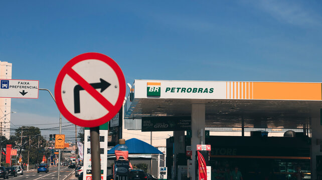 A prohibited turning arrow pointing at the Petrobras gas station. Photo made in Mogi das Cruzes, SP, Brazil in Oct 10 2023