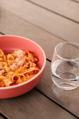 Table of italian meals on plates Pizza, pasta, ravioli, carpaccio, mushroom risotto, caprese salad and tomato bruschetta on rustic wooden background. Top view. Flat lay