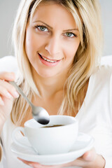 woman enjoying a cup of coffee