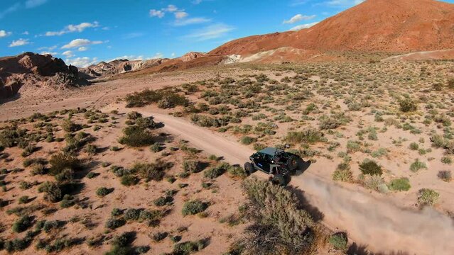 UTV driving on a dirt trail in the desert