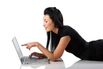 pretty and young asian woman looking at the laptop with a funny expression