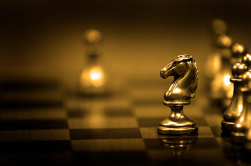 Chess Pieces on Board for Game and Strategy Golden Competition © Lane Erickson