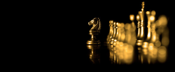 Pieces on chess board for playing game and strategy Golden chess © Lane Erickson
