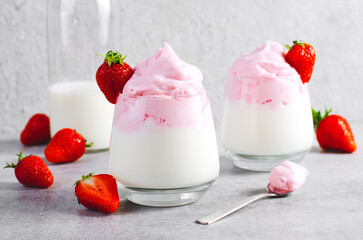 Whipped Strawberry Milk, Strawberry Milkshake, Dalgona Style Drink with Fresh Strawberry on Grey Background