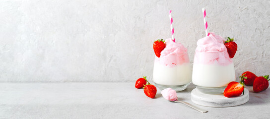 Whipped Strawberry Milk, Strawberry Milkshake, Dalgona Style Drink with Fresh Strawberry on Grey Background