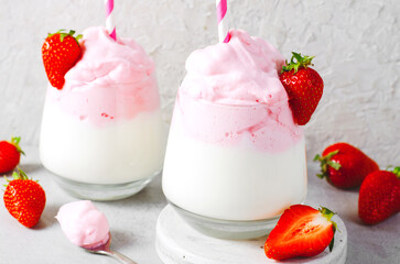 Whipped Strawberry Milk, Strawberry Milkshake, Dalgona Style Drink with Fresh Strawberry on Grey Background
