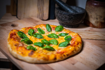 Authentic Neapolitan Pizza with Fresh Basil on Wooden Board
